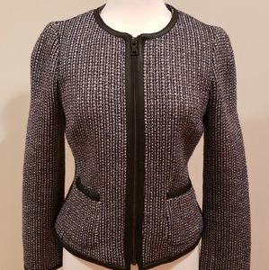 Worn once.Tweed jacket with black leather trimming
